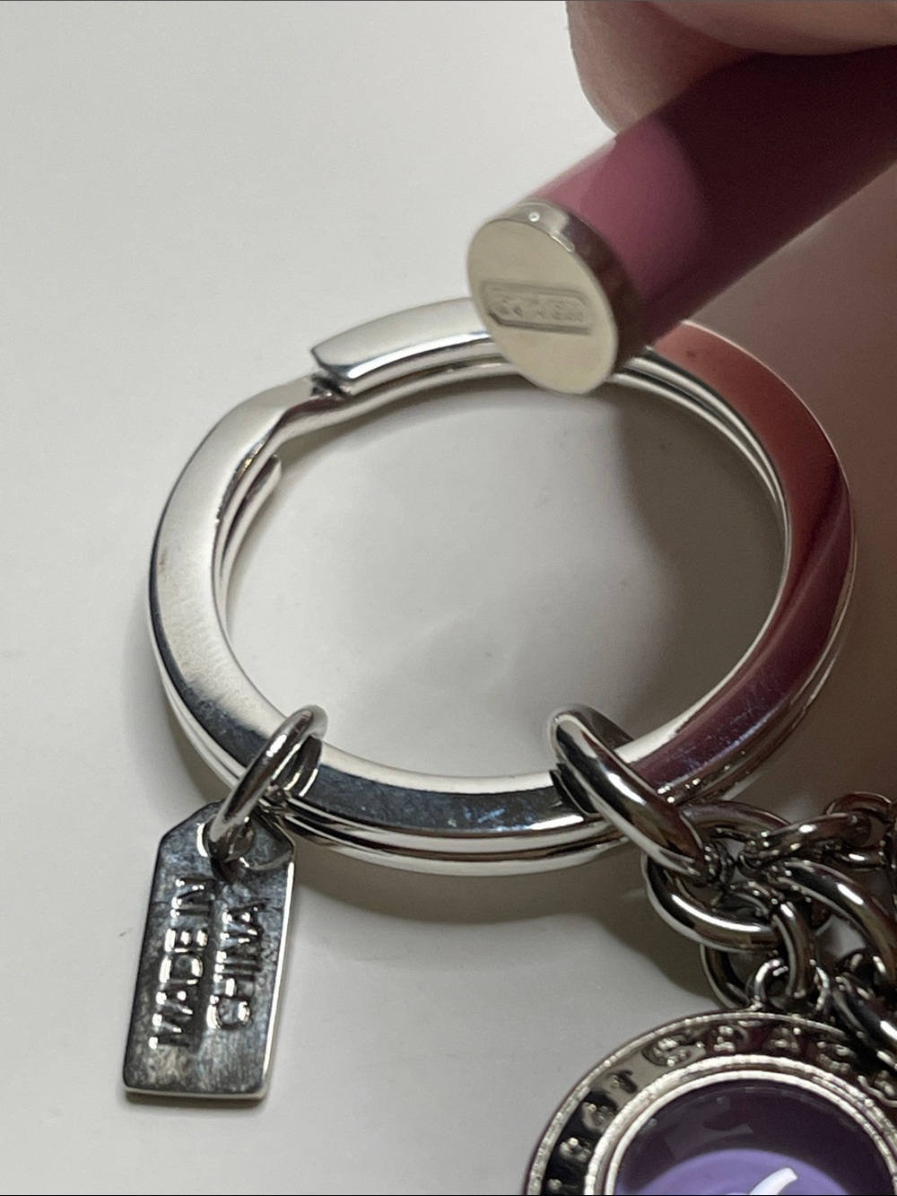 Coach Silver Circle Charm Keychain with Purple and Pink Accents and a Coach Pen - Picture 4 of 5